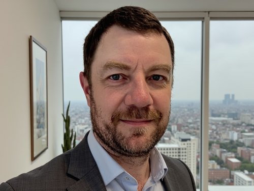 Scott Cate in a high rise office